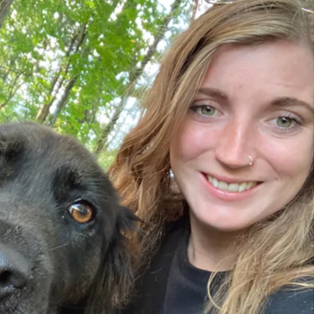 home_veterinary_team_7 Keely posing with black dog